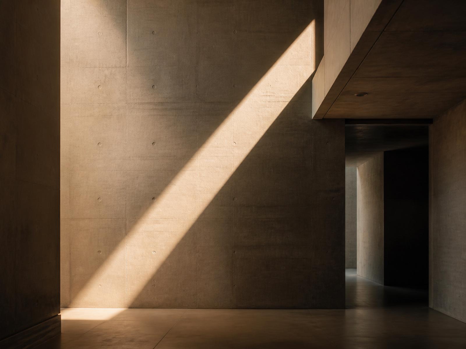 Sunlight across a concrete wall
